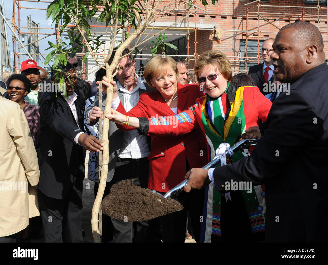 German Chancellor Angela Merkel visits the Township Khayelitsha in the area of Cape Town, South Africa, 03 July 2010.  The Chancellor visits a town-planning project in the Township of Khayelitsha for the prevention of violence, that has been supported by German funds. Merkel also got a briefing on the project 'Youth Development through Football' (YDF) which is realised by the Germa Stock Photo