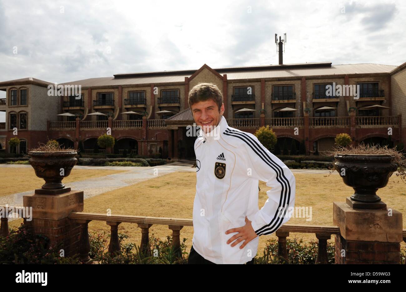 German player Thomas Mueller poses in front of of the German team hotel Velmore Grand in Erasmia near Pretoria, South Africa 05 July 2010. Photo: Marcus Brandt dpa - Stock Photo
