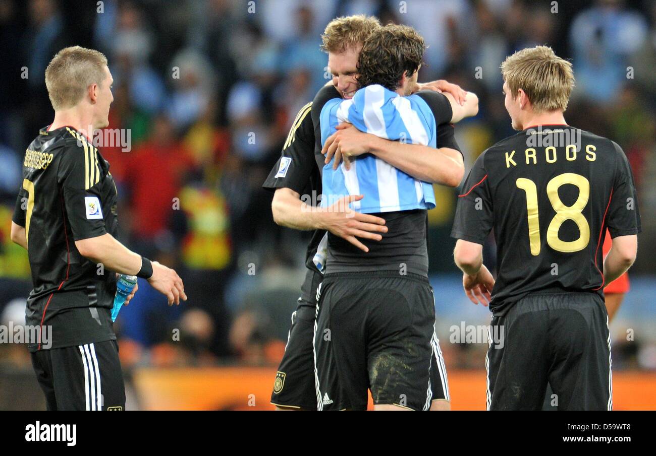 Bastian Schweinsteiger (L-R), Per Mertesacker, Arne Friedrich and Toni Kroos of Germany celebrate after the final whistle of the FIFA World Cup 2010 quarterfinal match between Argentina and Germany at the Green Point Stadium in Cape Town, South Africa 03 July 2010. Photo: Bernd Weissbrod dpa - Please refer to http://dpaq.de/FIFA-WM2010-TC Stock Photo