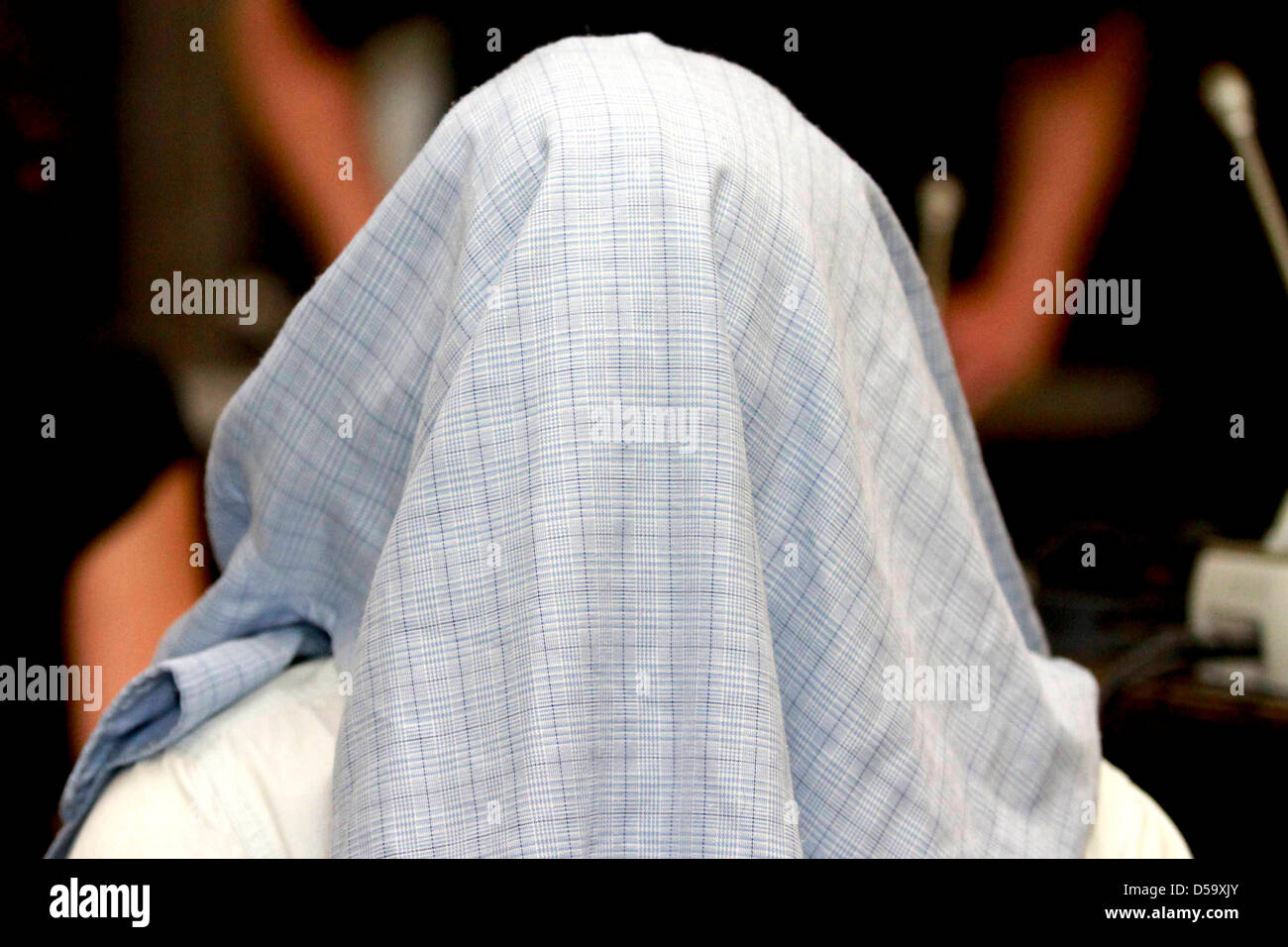 Defendant Rilwan C. is in the dock during his trial in Hamburg, Germany, 06 July 2010. Rilwan C. is charged with murder, allegedly he had gunned down a taxi driver on 14 January 2010 with three shots into the back of the head. Photo: PHILIPP GUELLAND Stock Photo