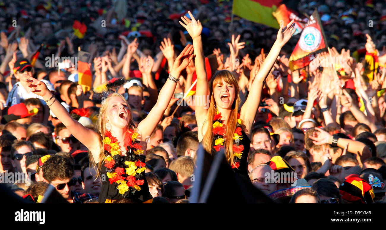 Soccer fans cheer for the German team at the public screening street