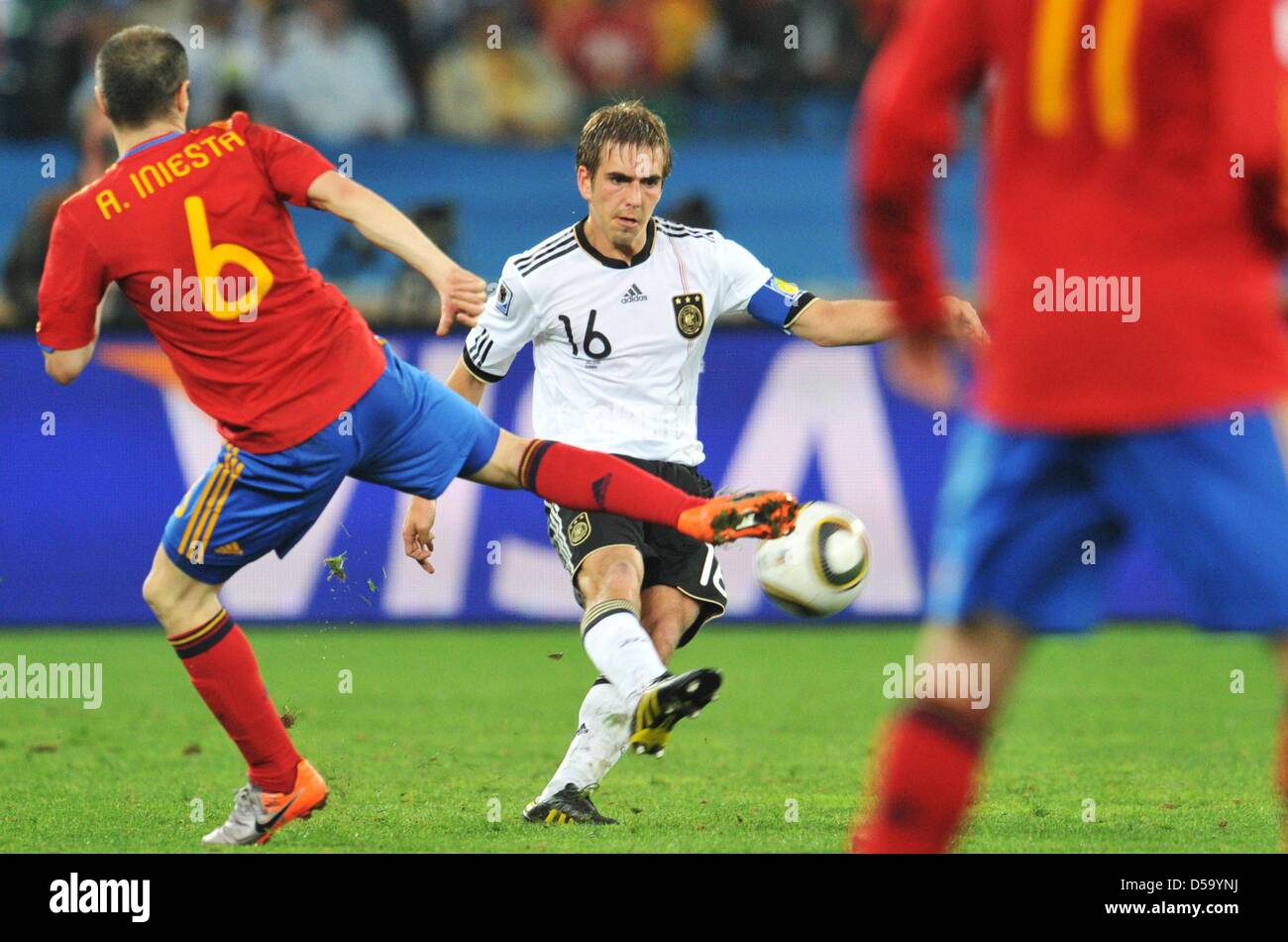 Andres Iniesta (L) of Spain vies with Philipp Lahm of Germany during the 2010 FIFA World Cup semi-final match between Germany and Spain at the Durban Stadium in Durban, South Africa 07 July 2010. Photo: Bernd Weissbrod dpa - Please refer to http://dpaq.de/FIFA-WM2010-TC Stock Photo