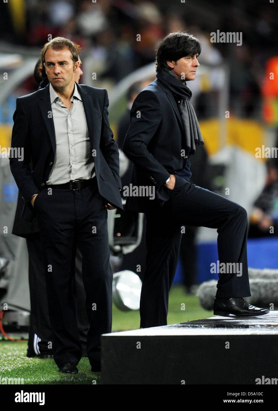 Headcoach Joachim Loew (R) and assistant coach Hans-Dieter Flick of Germany prior the 2010 FIFA World Cup third place match between Uruguay and Germany at the Nelson Mandela Bay Stadium in Port Elizabeth, South Africa 10 July 2010. Photo: Bernd Weissbrod dpa - Please refer to http://dpaq.de/FIFA-WM2010-TC Stock Photo