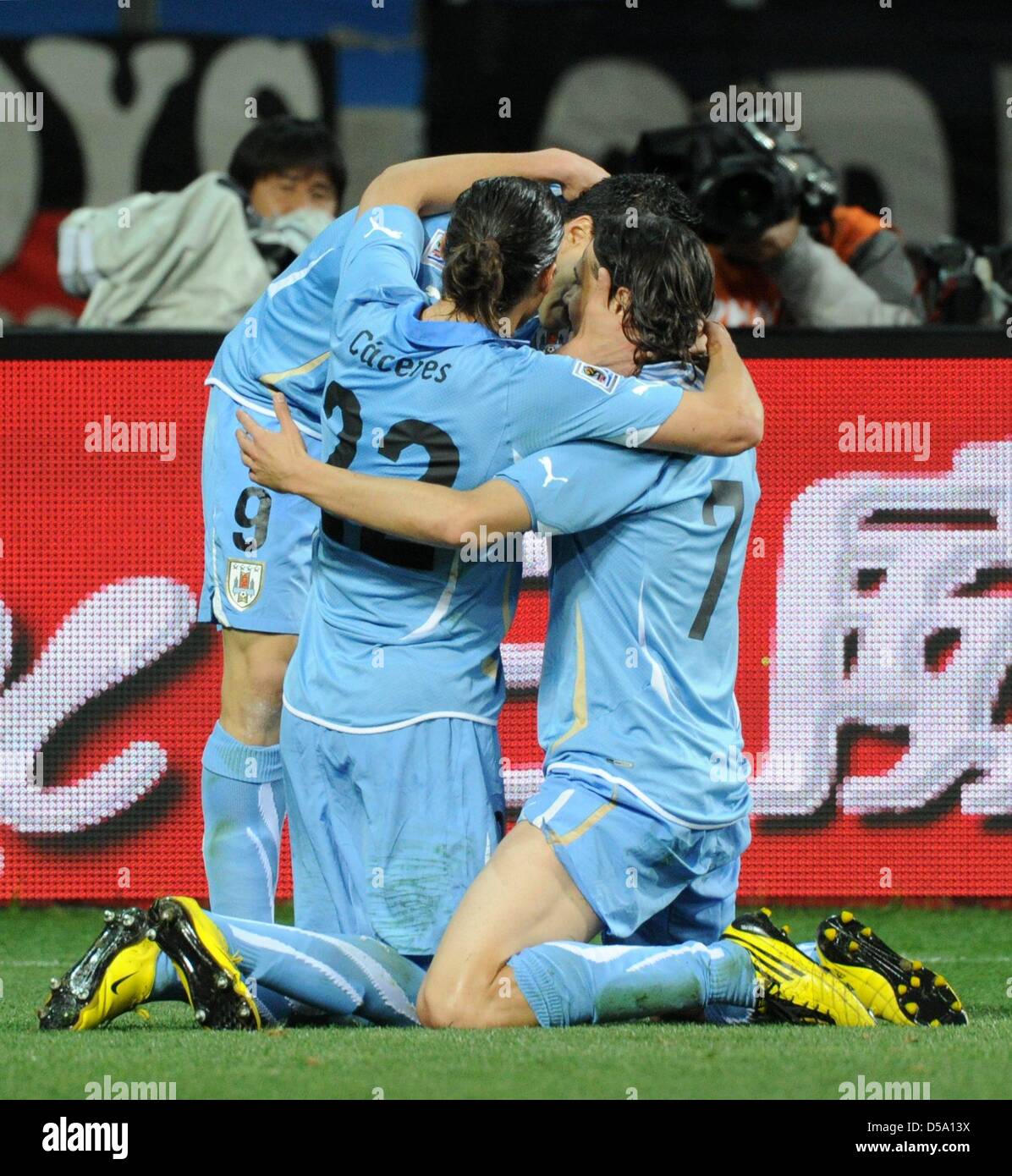 Uruguay's Edinson Cavani (R) celebrates with team mates Martin Caceres (22) and Luis Suarez after equalising 1-1 during the 2010 FIFA World Cup third place match between Uruguay and Germany at the Nelson Mandela Bay Stadium in Port Elizabeth, South Africa 10 July 2010. Photo: Marcus Brandt dpa - Please refer to http://dpaq.de/FIFA-WM2010-TC  +++(c) dpa - Bildfunk+++ Stock Photo