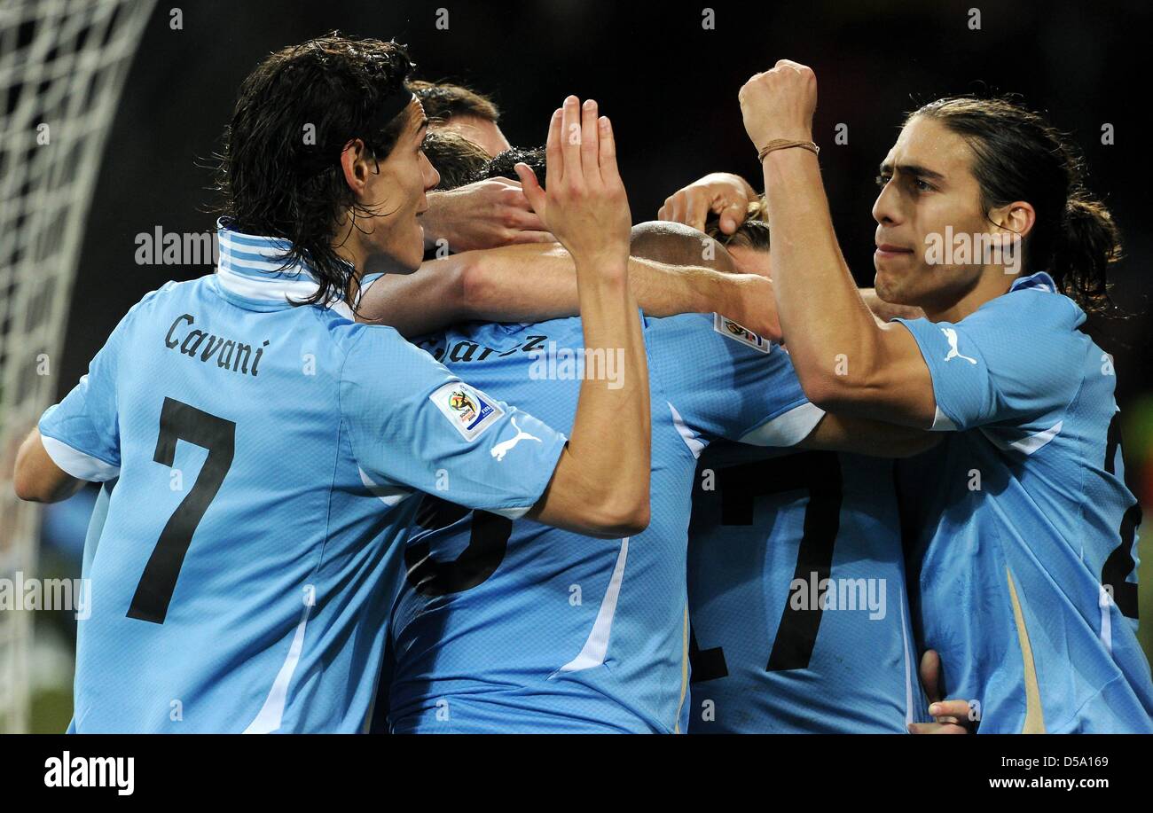 Uruguay's Edinson Cavani (L) and Martin Caceres celebrate after the 2-1 during the 2010 FIFA World Cup third place match between Uruguay and Germany at the Nelson Mandela Bay Stadium in Port Elizabeth, South Africa 10 July 2010. Photo: Marcus Brandt dpa - Please refer to http://dpaq.de/FIFA-WM2010-TC Stock Photo