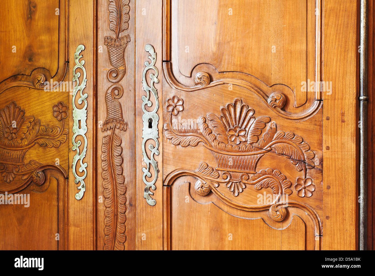 carved wooden door of old wardrobe Stock Photo