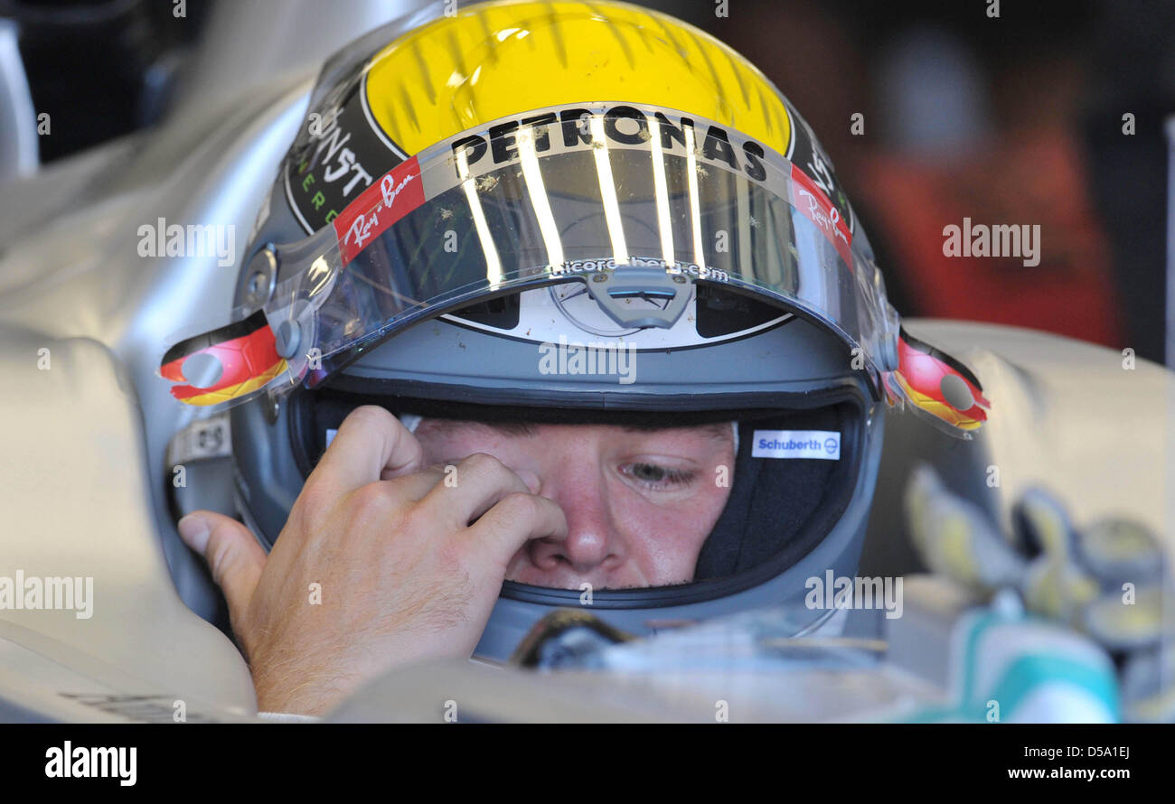 German Formula One race driver Nico Rosberg from the team Mercedes  GP sits in his car during the first training session at the race track in Silverstone, England, 9 July 2010. This weekend, the British grand prix starts with the tenth race of the Formula One season 2010. Photo: Carmen Jaspersen Stock Photo