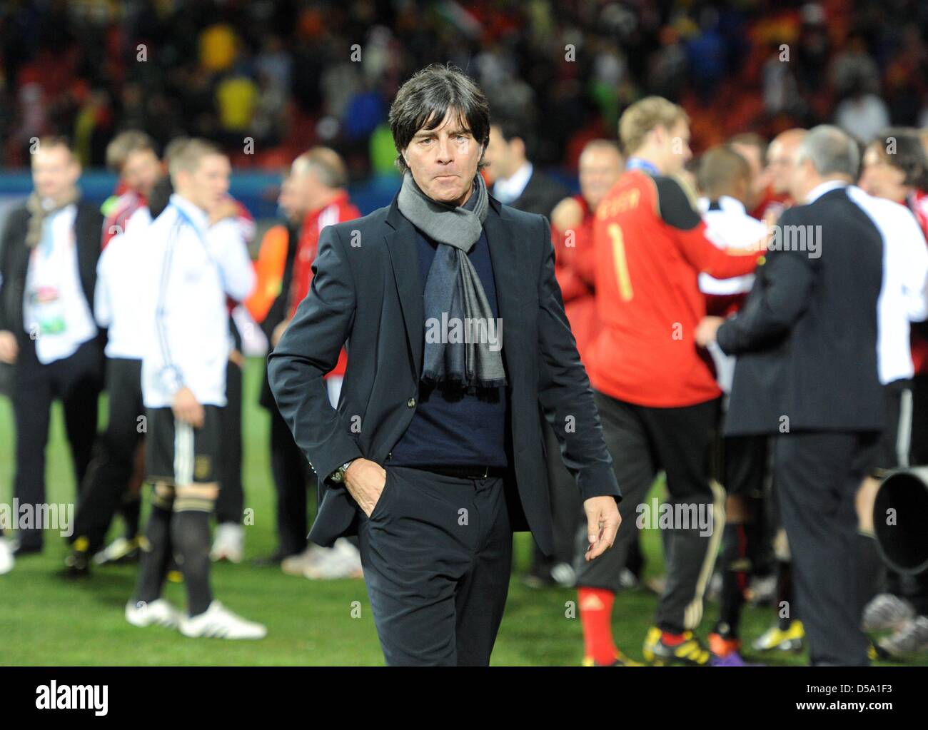 German coach Joachim Loew walks over the pitch after the 2010 FIFA World Cup third place match between Uruguay and Germany at the Nelson Mandela Bay Stadium in Port Elizabeth, South Africa 10 July 2010. Germany won 3:2. Photo: Marcus Brandt dpa - Please refer to http://dpaq.de/FIFA-WM2010-TC Stock Photo