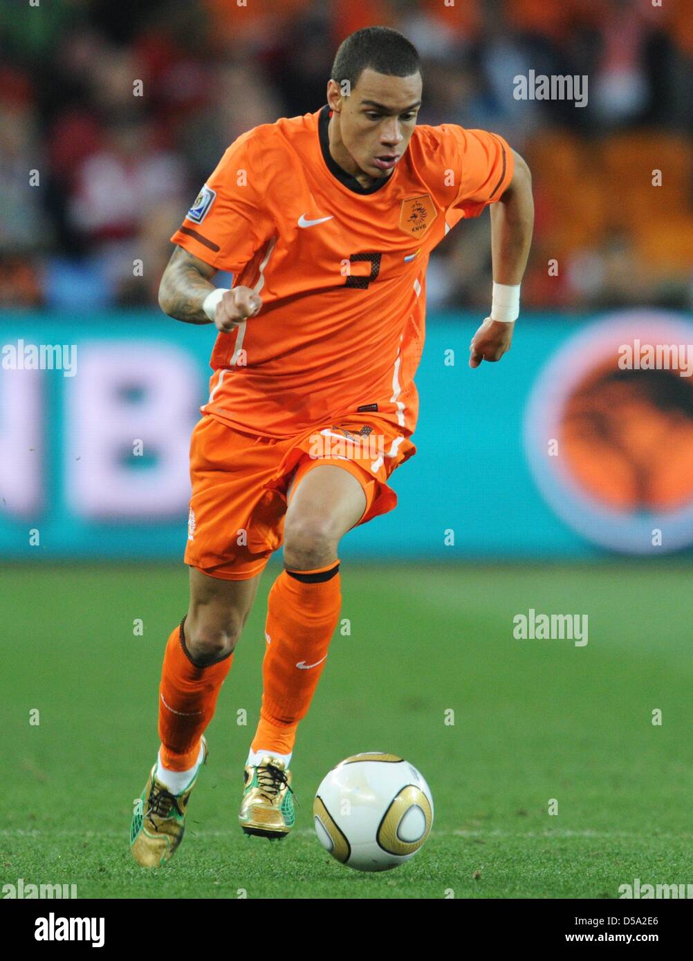 Gregory van der Wiel of the Netherlands controls the ball during the 2010  FIFA World Cup final match between the Netherlands and Spain at the Soccer  City Stadium in Johannesburg, South Africa