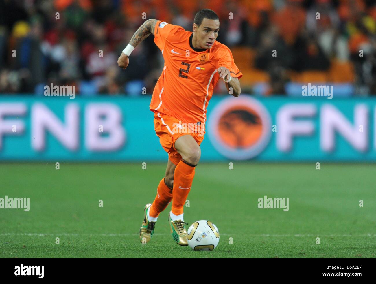 Gregory van der Wiel of the Netherlands controls the ball during the 2010  FIFA World Cup final match between the Netherlands and Spain at the Soccer  City Stadium in Johannesburg, South Africa