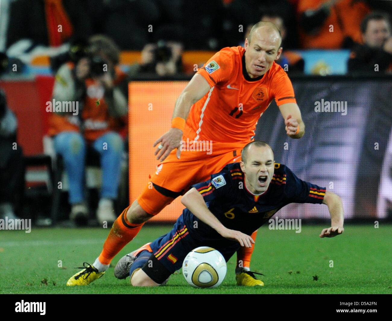 Arjen Robben (top) of the Netherlands vies with Andres Iniesta of Spain during the 2010 FIFA World Cup final match between the Netherlands and Spain at the Soccer City Stadium in Johannesburg, South Africa 11 July 2010. Photo: Bernd Weissbrod dpa - Please refer to http://dpaq.de/FIFA-WM2010-TC  +++(c) dpa - Bildfunk+++ Stock Photo