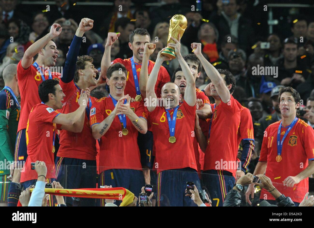 Andres Iniesta of Spain lifts the trophy after the 2010 FIFA World Cup final match between the Netherlands and Spain at the Soccer City Stadium in Johannesburg, South Africa 11 July 2010. Photo: Bernd Weissbrod dpa - Please refer to http://dpaq.de/FIFA-WM2010-TC  +++(c) dpa - Bildfunk+++ Stock Photo