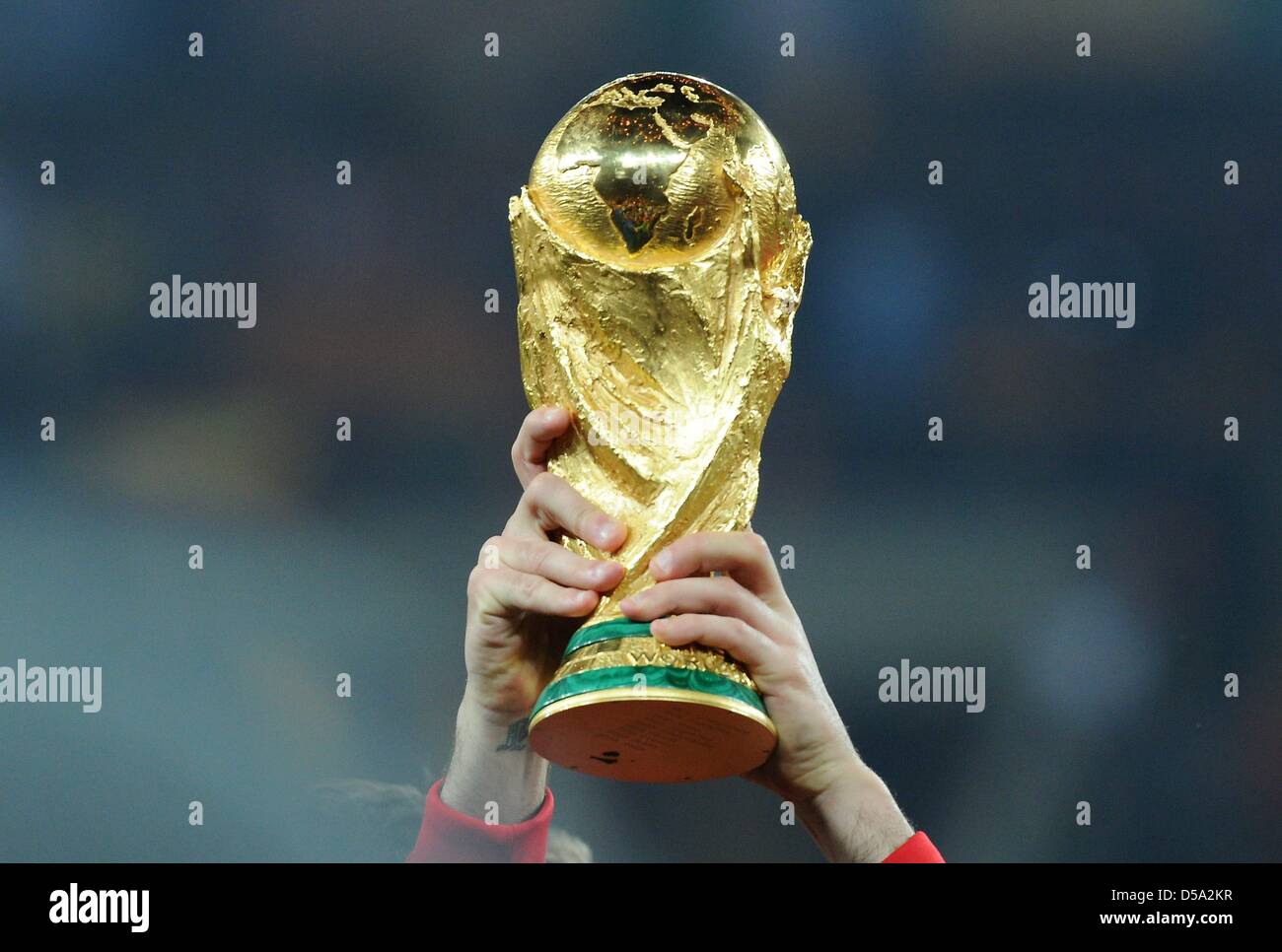 The World Cup trophy is lifted after the 2010 FIFA World Cup final match between the Netherlands and Spain at Soccer City Stadium in Johannesburg, South Africa 11 July 2010. Photo: Marcus Brandt dpa - Please refer to http://dpaq.de/FIFA-WM2010-TC  +++(c) dpa - Bildfunk+++ Stock Photo