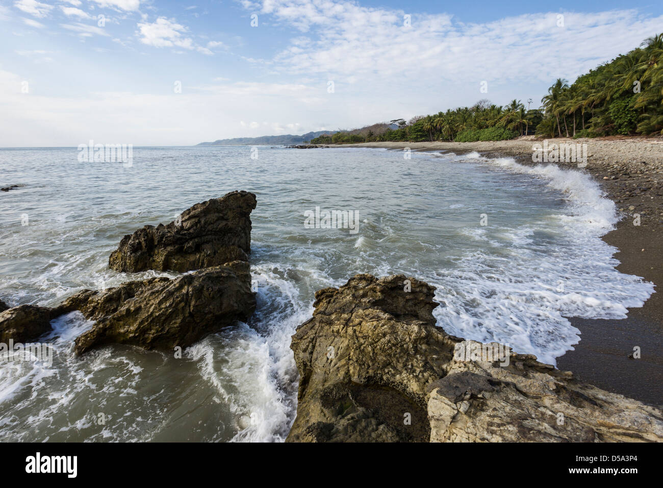 Rocky coastline of Malpais beach, Puntarenas Province, Costa Rica. Stock Photo