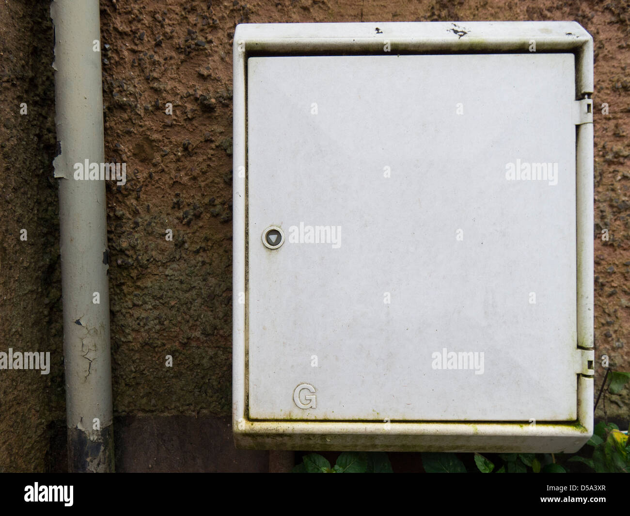 Gas meter box on house exterior. Stock Photo