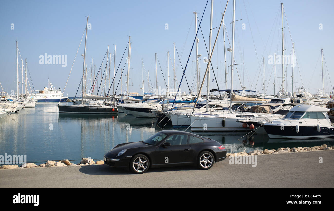 View of luxury cars and yachts at a private marina in Limassol, Cyprus, 24 March 2013. Photo: Florian Schuh Stock Photo