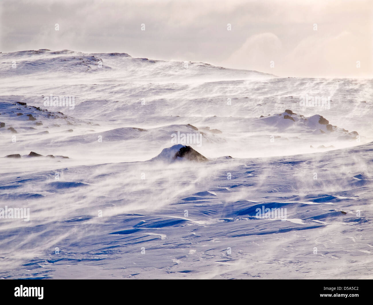 Blowing spindrift in the mountains of Arctic Norway Stock Photo