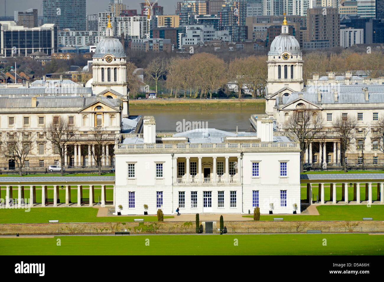 Queens House with Royal Naval College and River Thames beyond seen from hill in park Stock Photo