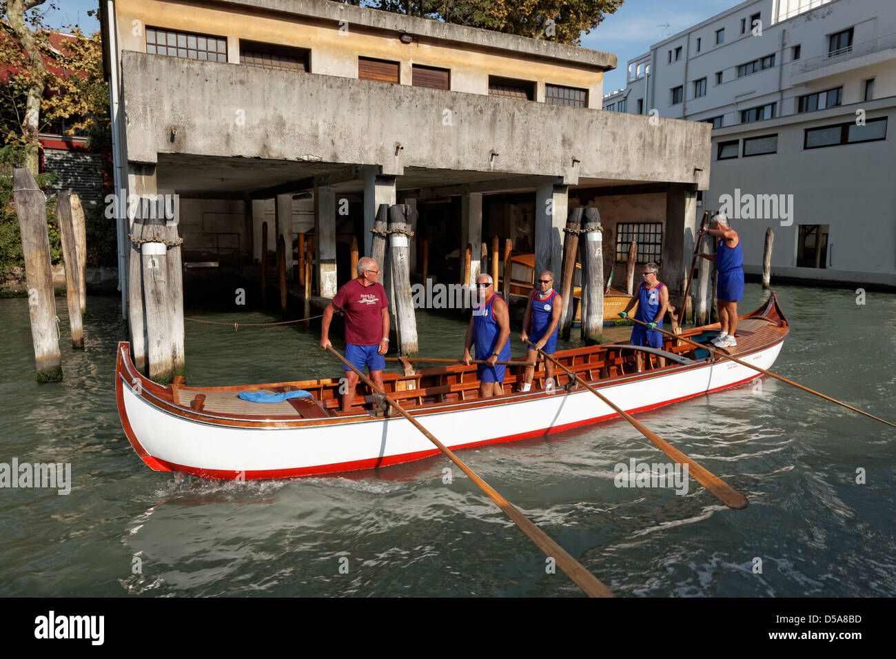 Traditional rowing boat on the Grand Canal in Venice. This