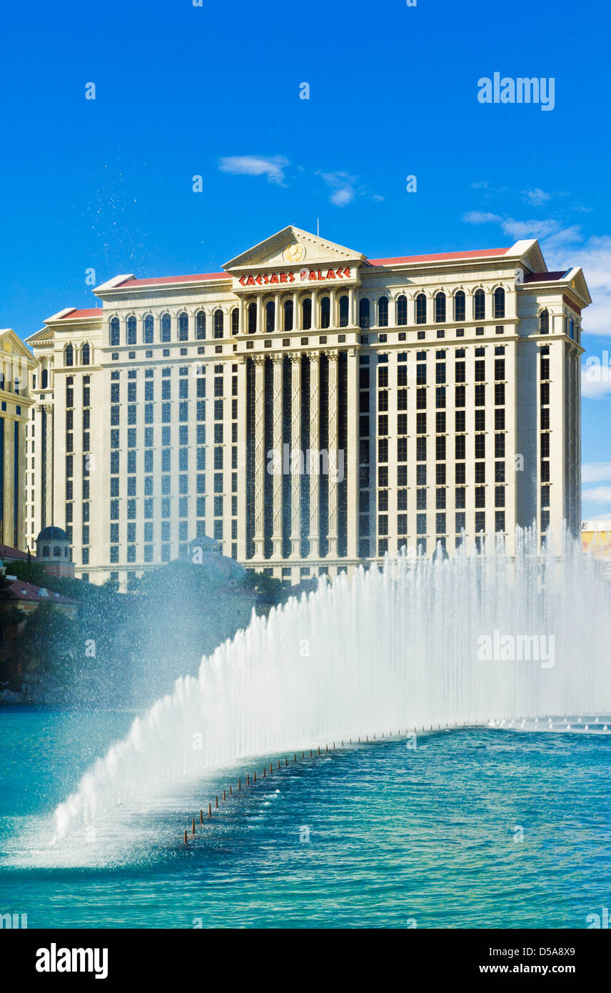 Water fountains outside the Bellagio hotel with Caesars Palace hotel behind, The Strip, Las Vegas Nevada USA Stock Photo