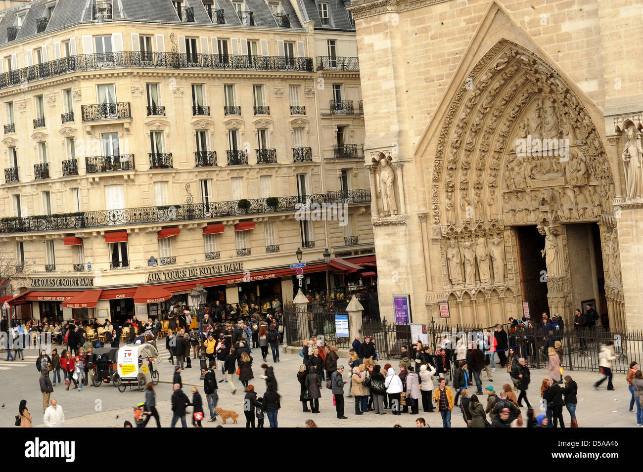 Crowded street outside the Notre Dame Paris France. tourism tourists landmark French busy streets street Stock Photo
