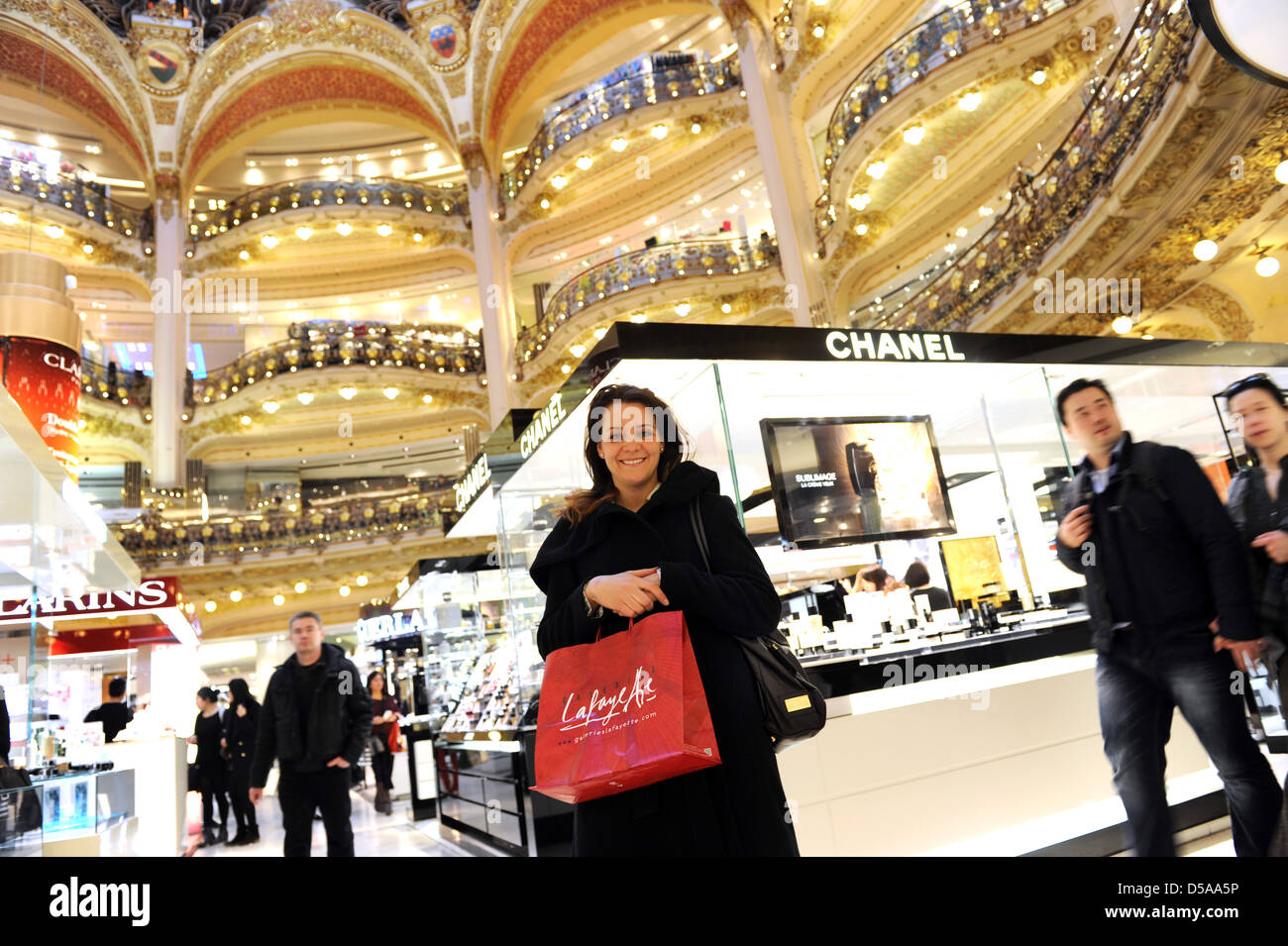 Woman shopping Galeries Lafayette department store in Paris France