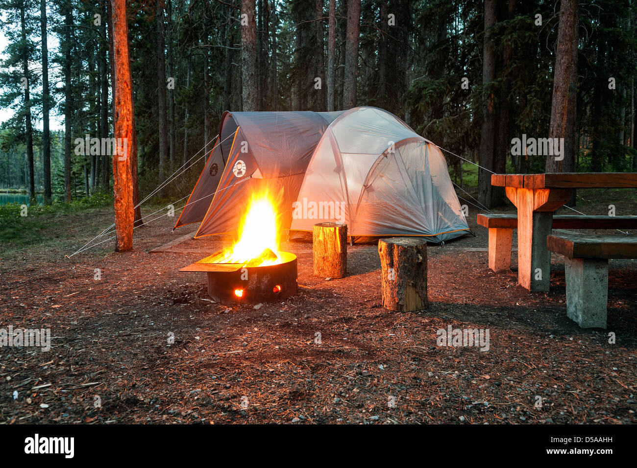 Campsite with burning campfire at dusk, Two Jack Lake, Banff National Park, Alberta, Canada Stock Photo