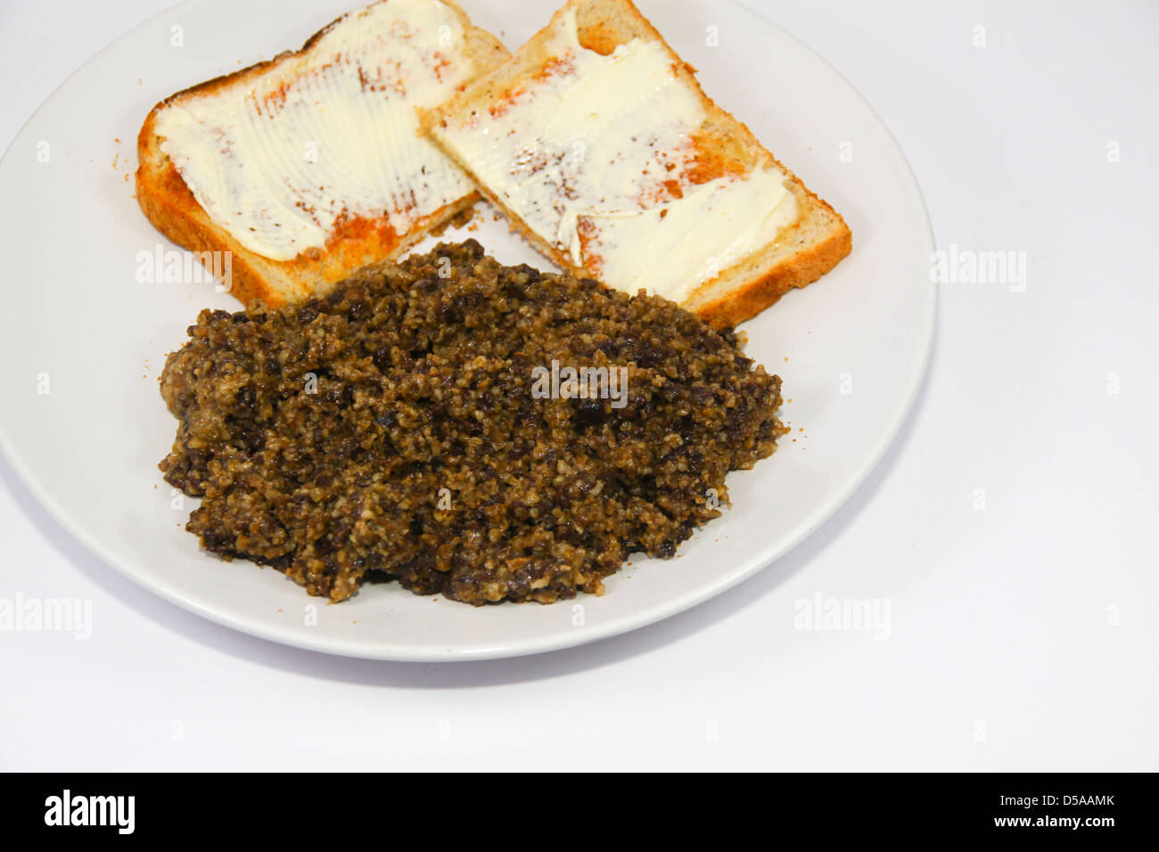 tinned haggis with buttered toast Stock Photo