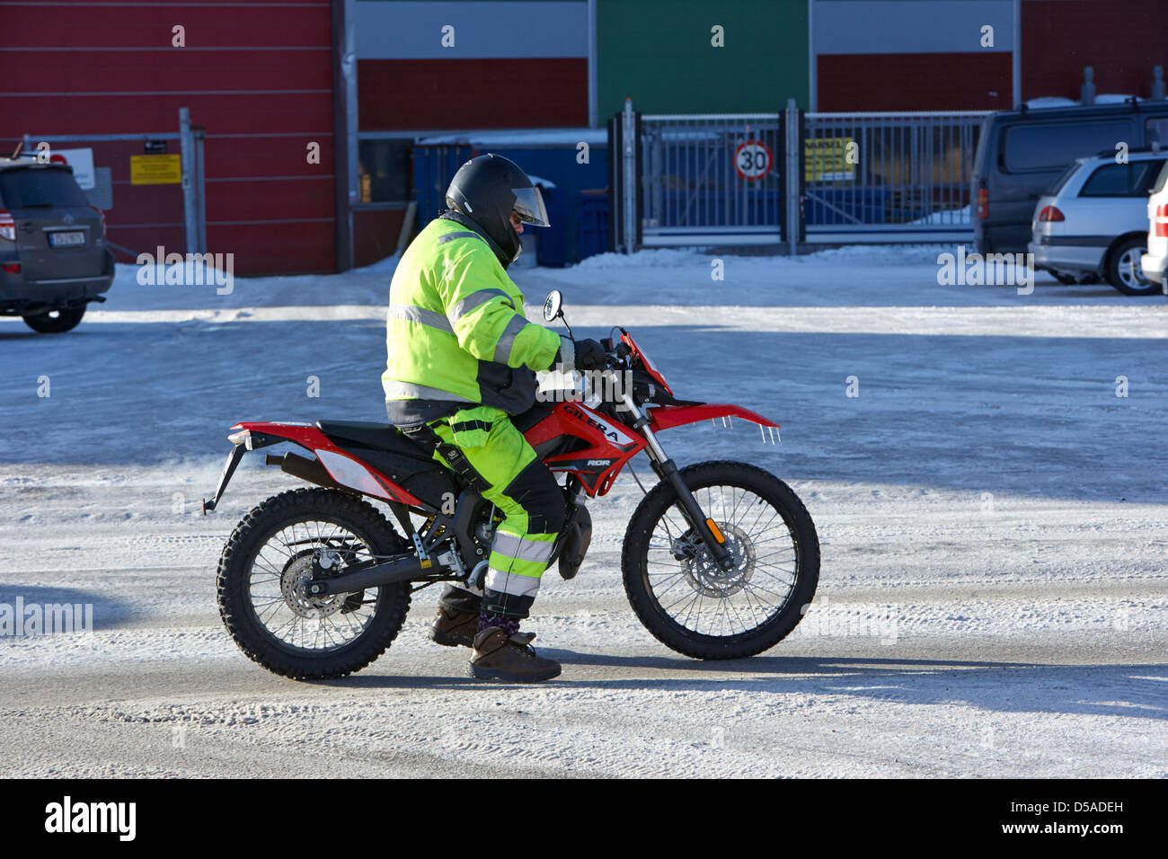 man driving gilera rcr moped on ice road kirkenes finnmark norway europe Stock Photo