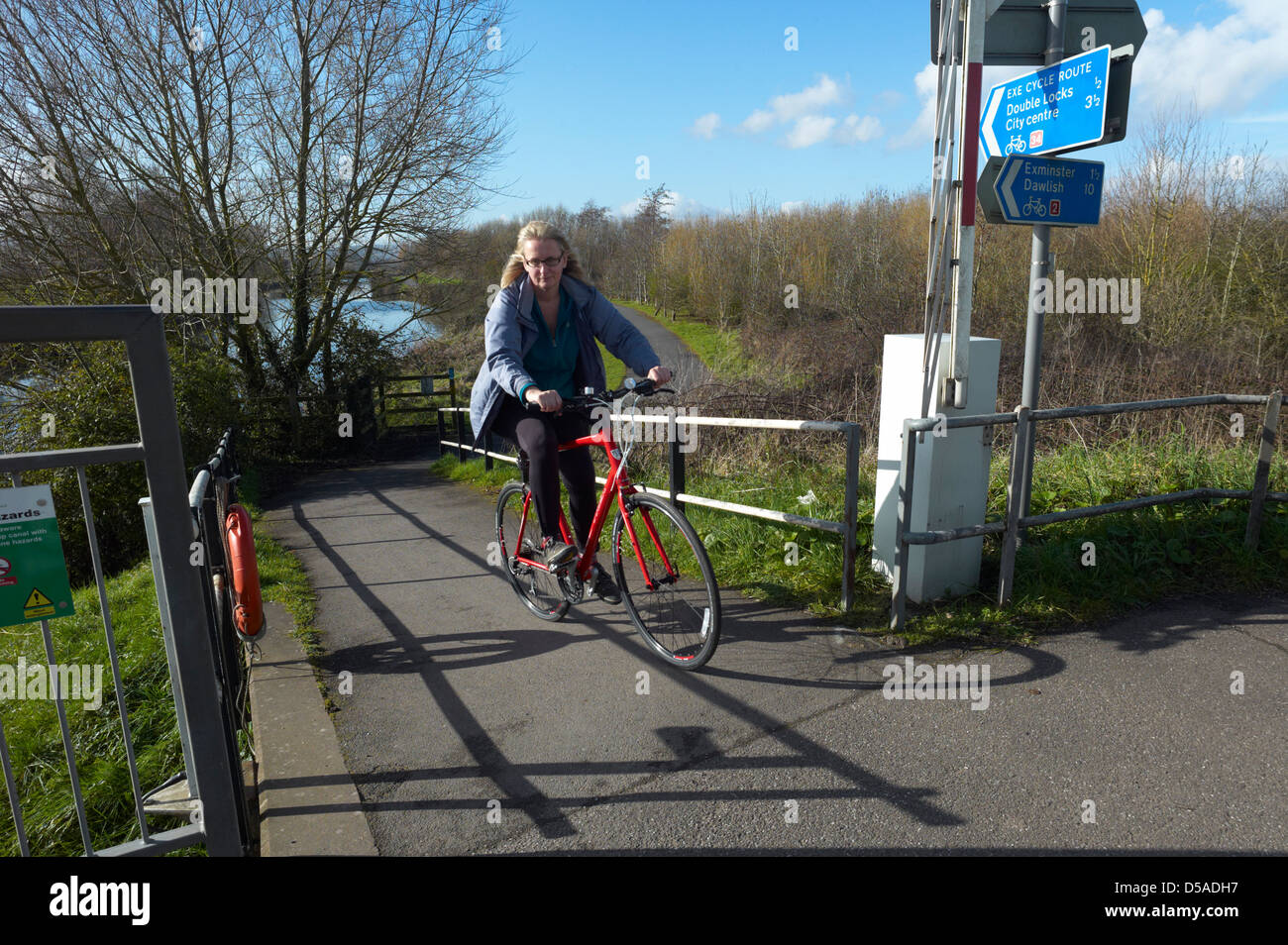 cyclist on the exe cycle route at Countess Wear swing bridge Exeter Devon Stock Photo