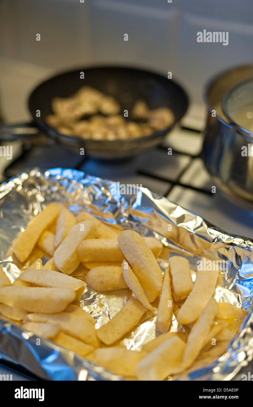 oven chips ready to be put into the oven for a uk evening meal Stock