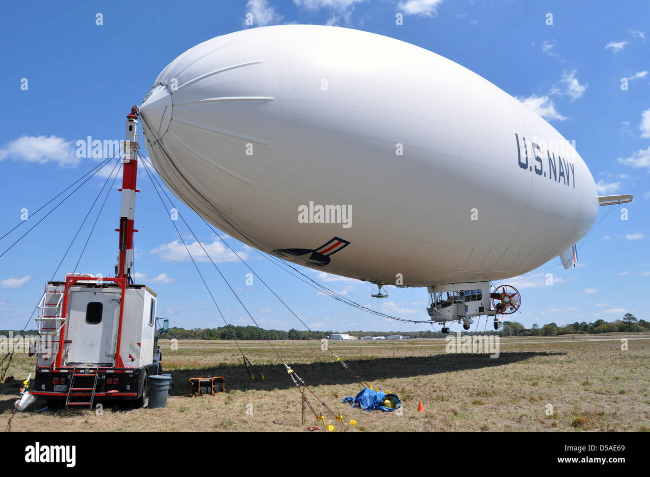 The US Navy airship MZ-3A moored at Fernandina Beach Municipal Airport March 26, 2013 in Fernandina, Florida. The airship is a test platform for surveillance cameras, radars and other sensors. Stock Photo