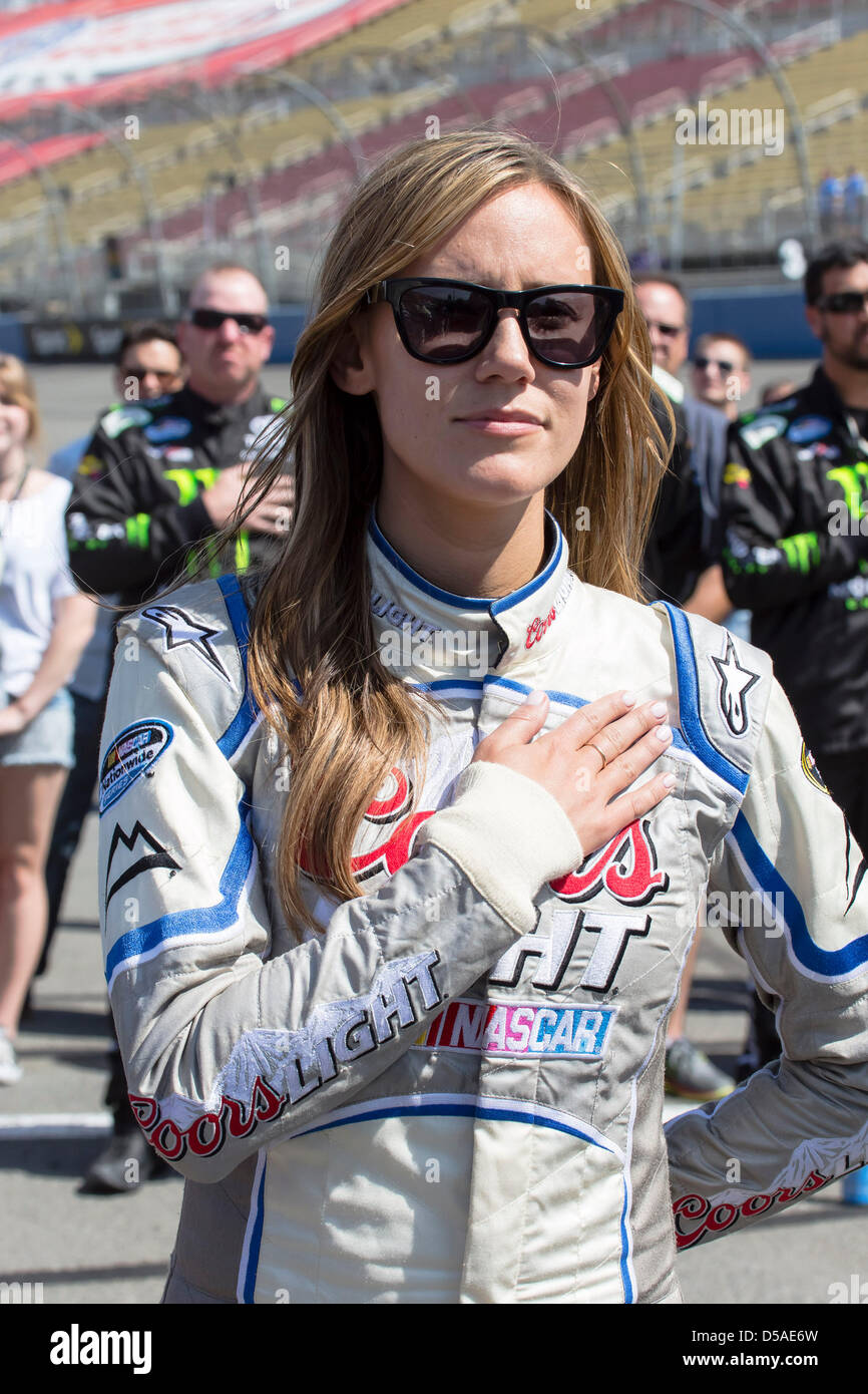 March 23, 2013 - Fontana, CA, U.S. - FONTANA, CA - Mar 23, 2013: Miss Coors Light, Rachel Rupert, stands for the National Anthem before the start of the Royal Purple 300 at the Auto Club Speedway in FONTANA, CA. Stock Photo