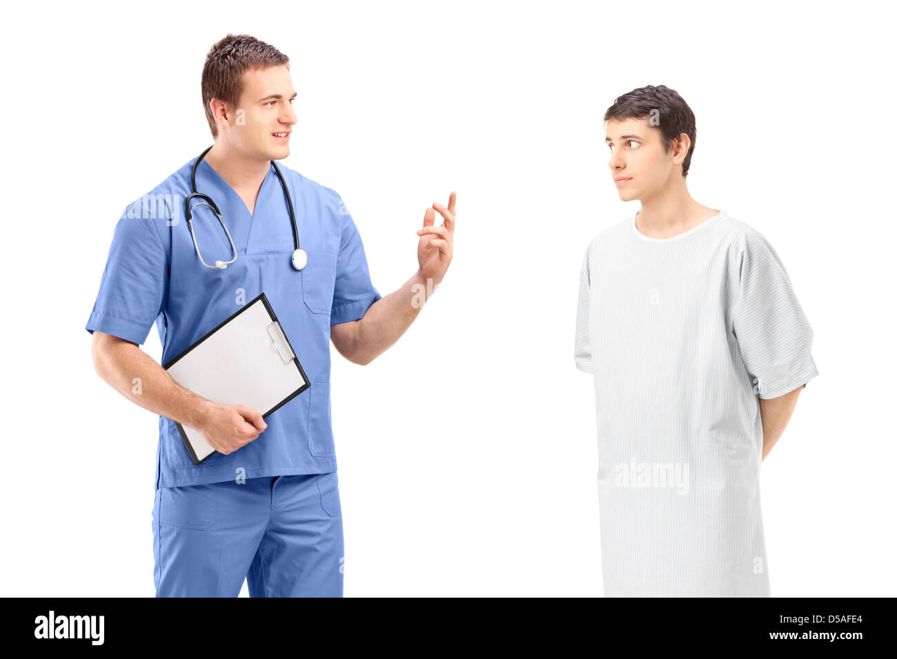A male patient in a hospital gown and medical practitioner during a discussion isolated on white background Stock Photo