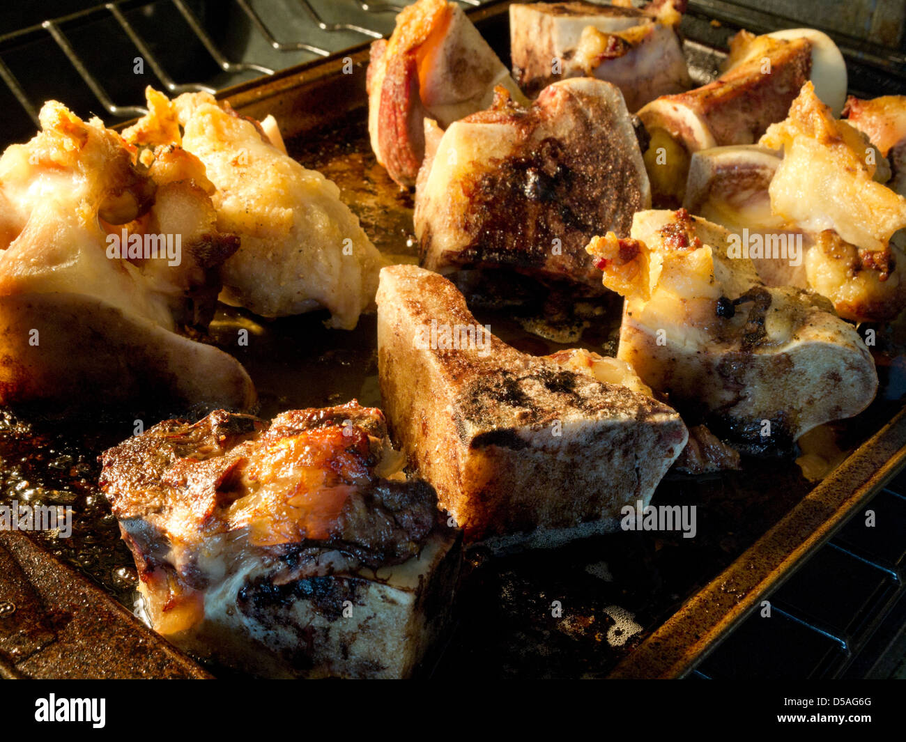Beef bones roasting for stock Stock Photo Alamy