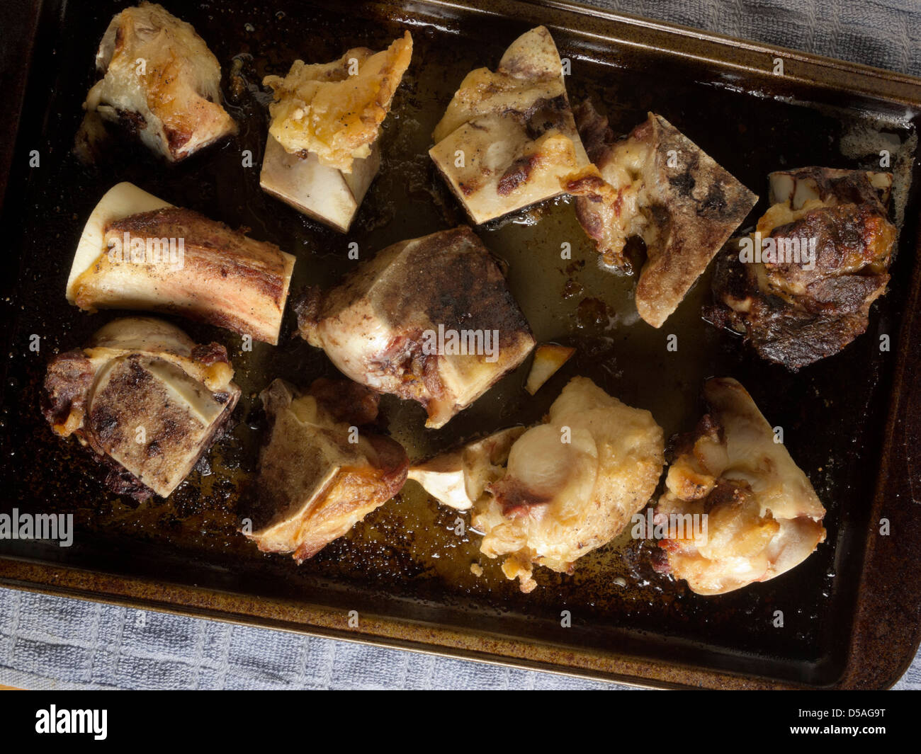 Beef bones roasting for stock Stock Photo Alamy