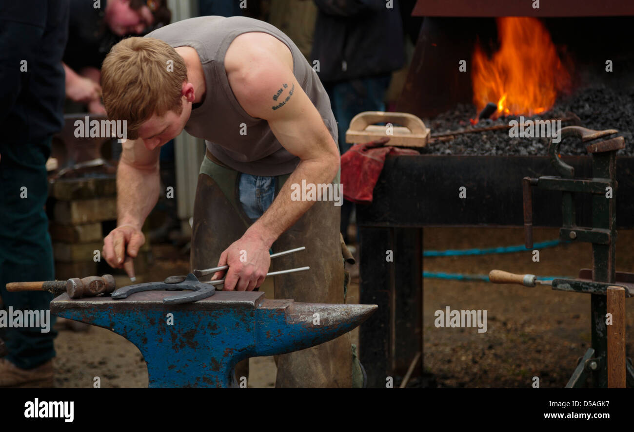 A farrier making horseshoe Stock Photo Alamy