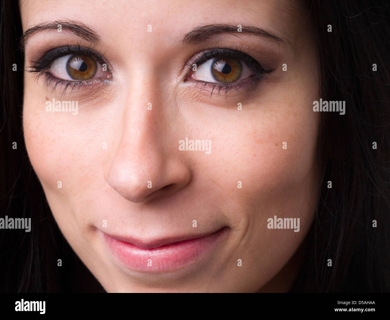 Close up portrait of happy young woman wearing make up Stock Photo