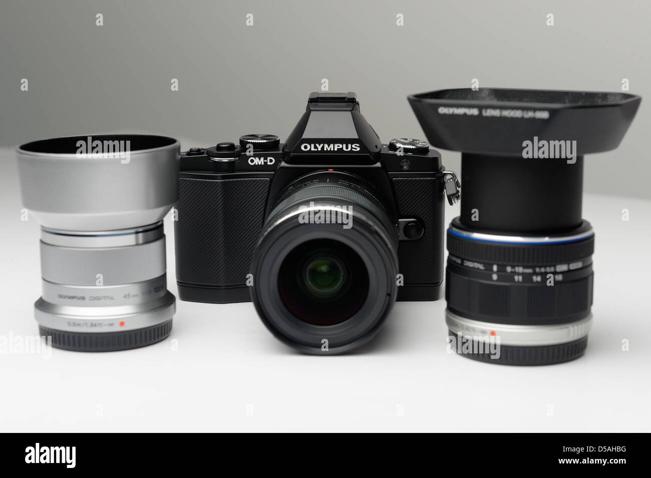 m43 mirrorless camera system with OM-D body and 12-50mm, 9-18mm and 45mm lenses Stock Photo