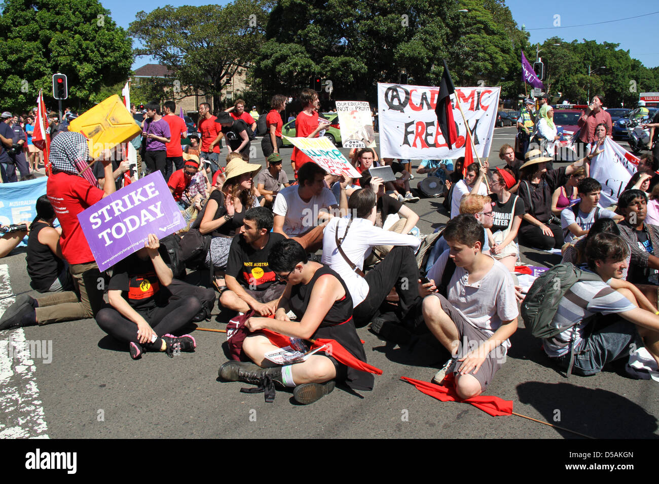 Sydney, Australia. 27th March 2013. Students assembled outside the University of Technology Sydney (UTS) and were joined by a group from Sydney University that had marched about 1.5kms to join them. After listening to speakers they joined together and marched back to Sydney University where they sat and blocked the road for about 15 minutes before uniting with the second day of the 48-hour National Tertiary Education Union (NTEU) strikers. Sydney, NSW, Australia. 28 March 2013. Credit:  Richard Milnes / Alamy Live News. Stock Photo