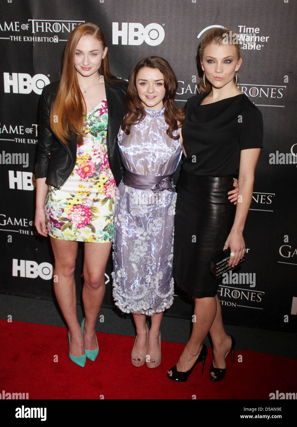 New York, USA. 27th March 2013. Actresses SOPHIE TURNER, MAISIE WILLIAMS and NATALIE DORMER attend the opening the installation of 'Game of Thrones: The Exhibition' held in midtown Manhattan. (Credit Image: Credit:  Nancy Kaszerman/ZUMAPRESS.com/Alamy Live News) Stock Photo