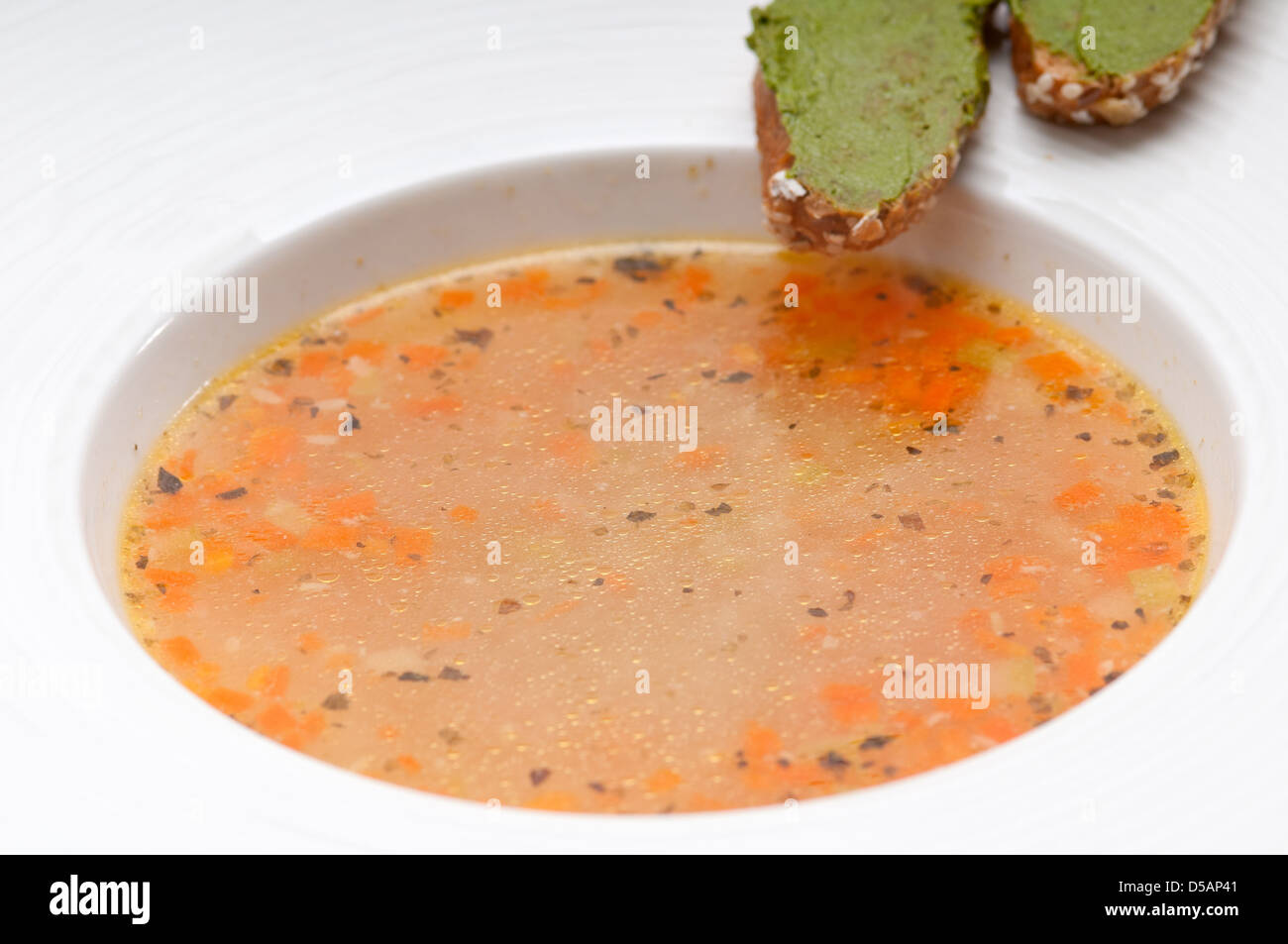 classic Italian minestrone " passato"soup with pesto crostini on side