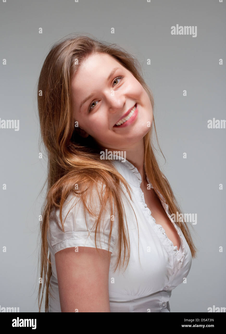 portrait of a young beautiful woman with brown hair smiling - isolated ...