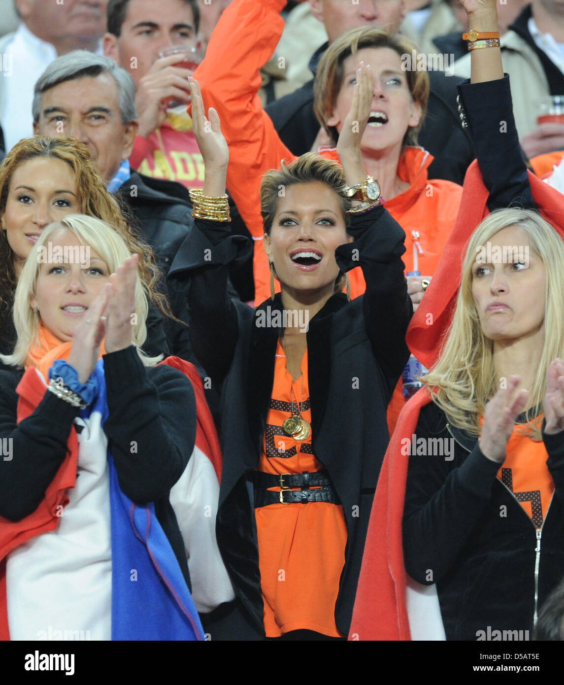 Bouchra van Persie (L-R), wife of Dutch player Robin van Persie, Bernadien Robben, wife of Dutch player Arjen Robben, Sylvie van der Vaart, wife of Dutch player Rafael van der Vaart, and Andra van Bommel, wife of Dutch player Mark van Bommel on the stand prior to the 2010 FIFA World Cup final match between the Netherlands and Spain at Soccer City Stadium in Johannesburg, South Afri Stock Photo