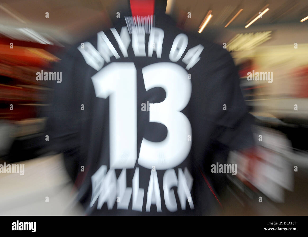 The jersey of the former and newly returned player of Bayer Leverkusen,  Michael Ballack, hangs in a fan shop during the presentation of the  national team player in Leverkusen, Germany, 14 July