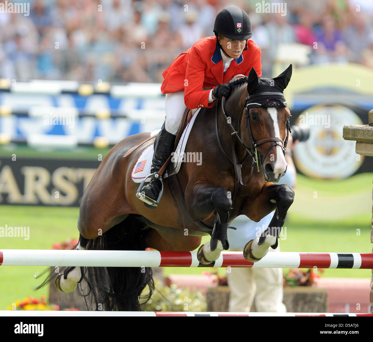 USA's Beezie Madden and her horse 'Coral Reef Via Volo' overcome an Stock  Photo - Alamy
