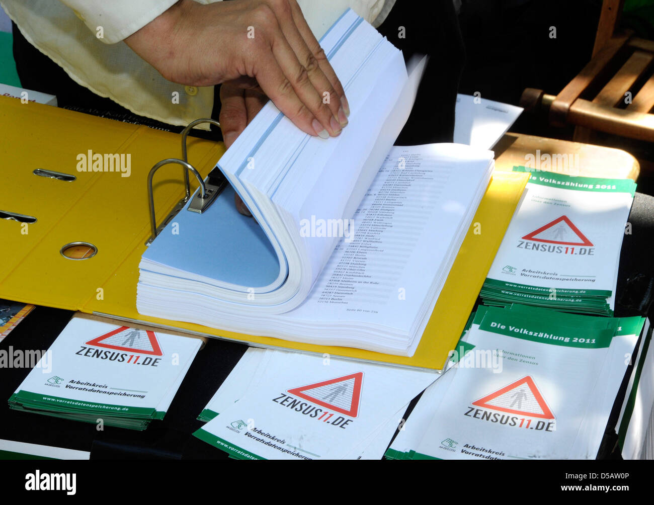 Civil rights activists show a file with over 13 000 signed petitions ...