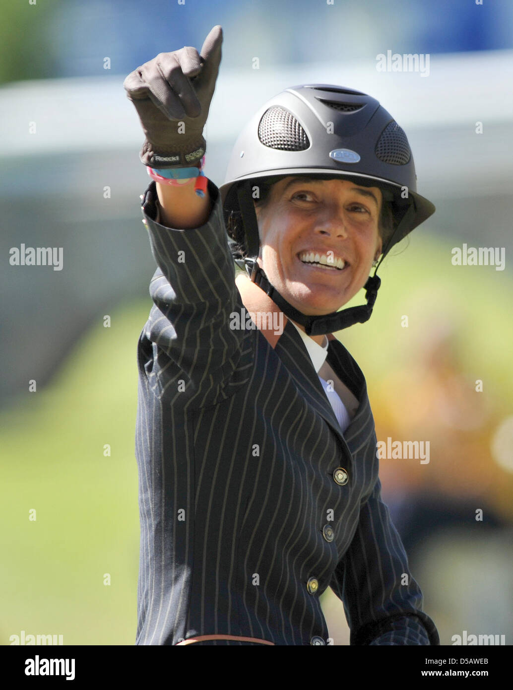 Portuguese rider Luciana Diniz celebrates her third place at the 'World