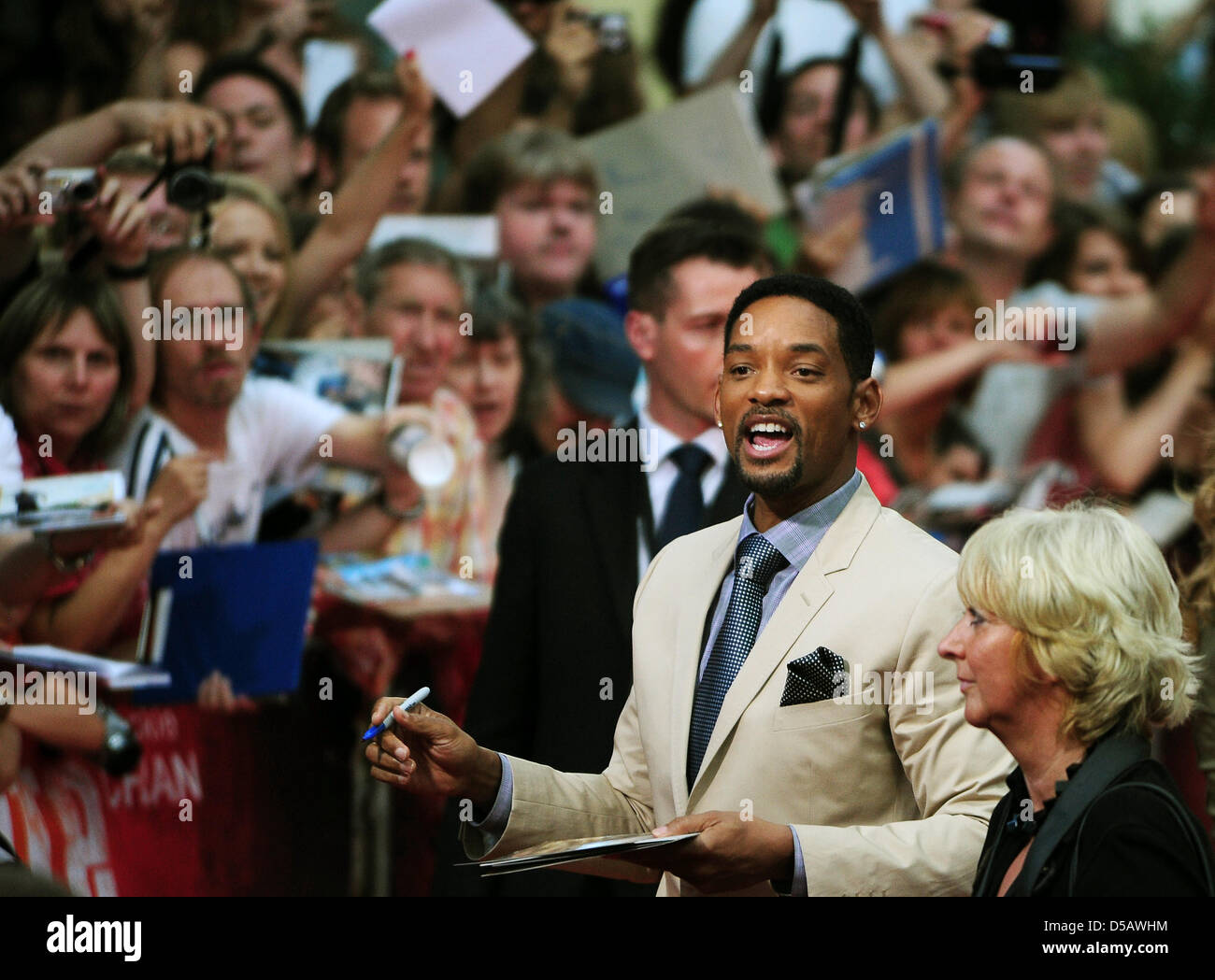 American actor Will Smith signs autographs on the red carpet at the premier of 'Karate Kid' in Berlin, Germany, 19 July 2010. The film will be shown in German cinemas starting 22 July 2010. Photo: Hannibal Hanschke Stock Photo