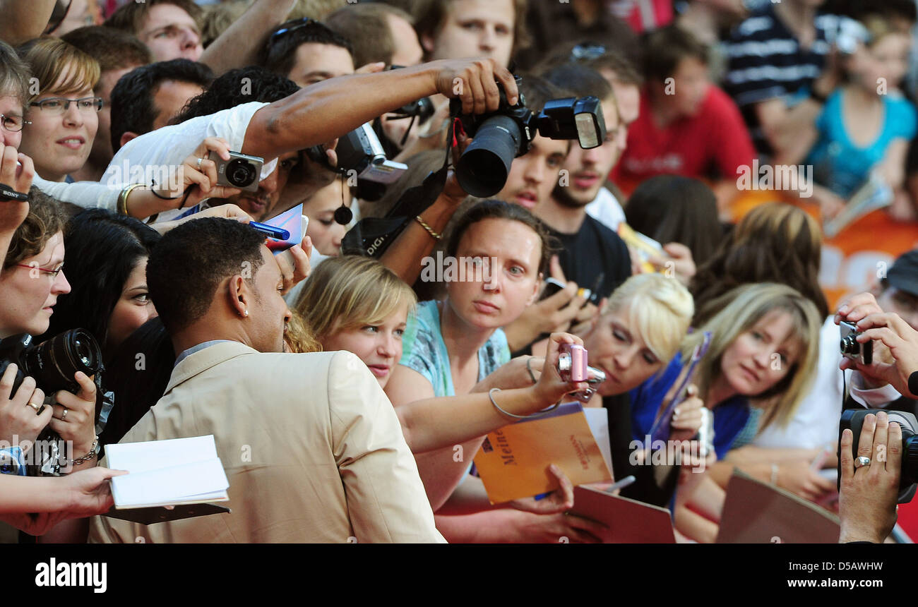 American actor Will Smith takes pictures with fans on the red carpet at the premier of 'Karate Kid' in Berlin, Germany, 19 July 2010. The film will be shown in German cinemas starting 22 July 2010. Photo: Hannibal Hanschke Stock Photo